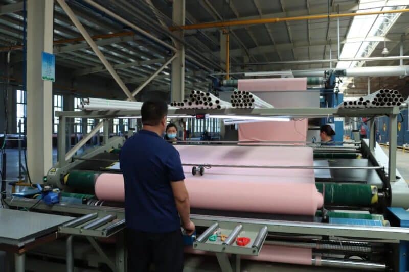 dyeing machine and finished fabric rolls